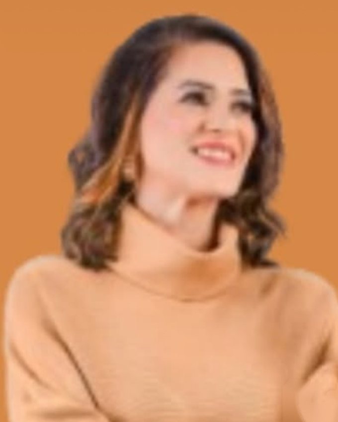 Retrato de Marina Araújo, nutricionista, sorrindo.